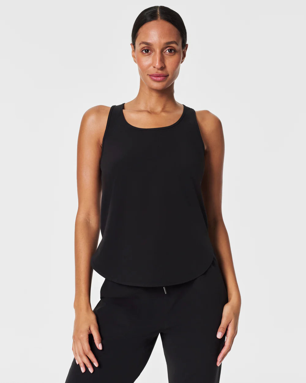 Spanx On The Move Curved Hem Tank | Black bold tank top